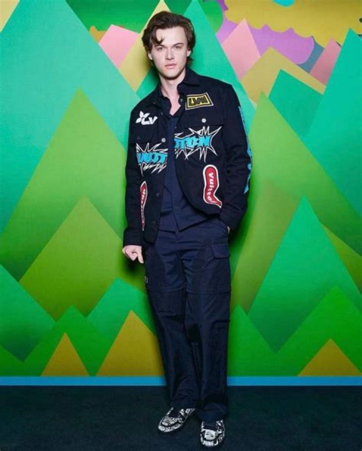 Christopher Briney walking for Louis Vuitton in Paris. 